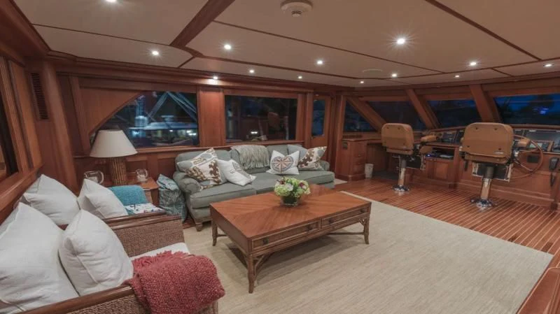 a living room with a couch and a coffee table aboard ANNDRIANNA Yacht for Sale