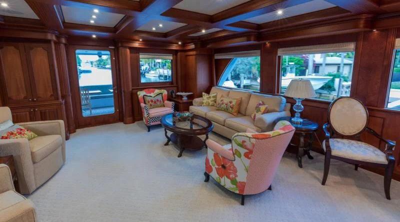 a living room with a couch and a table aboard ANNDRIANNA Yacht for Sale