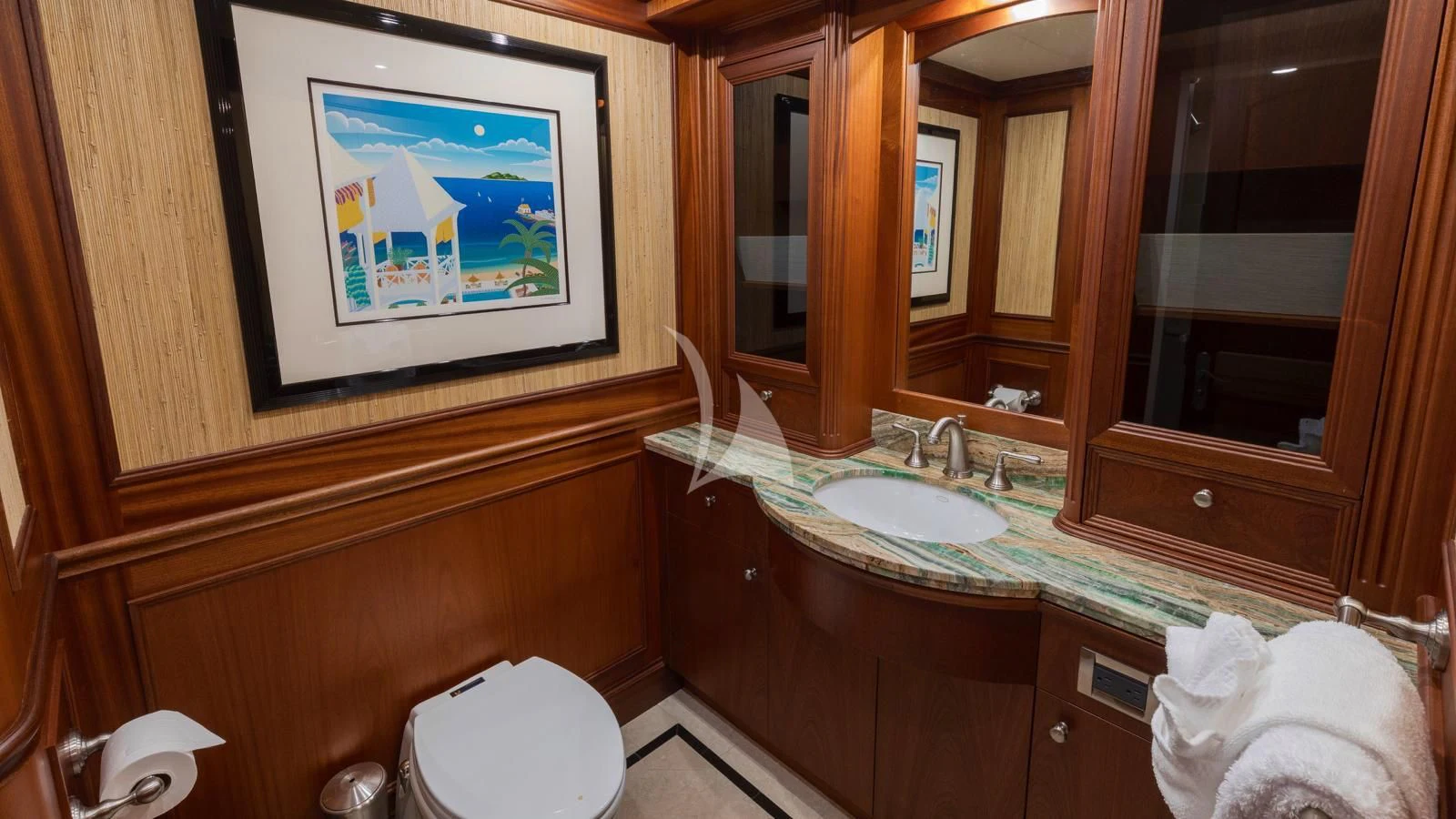 a bathroom with a television and a sink aboard ANNDRIANNA Yacht for Sale