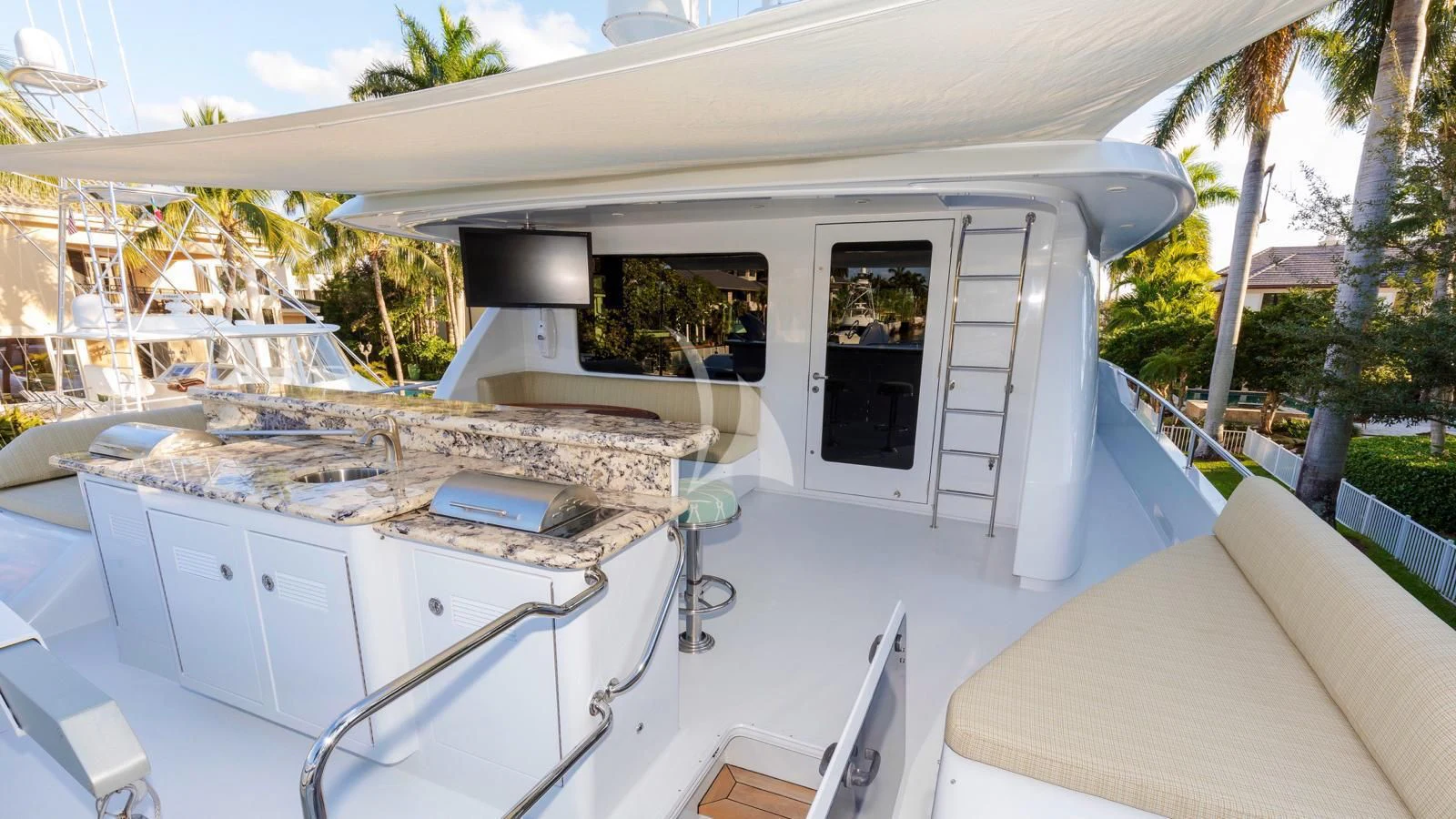 a white tent with a deck and a pool table aboard ANNDRIANNA Yacht for Sale