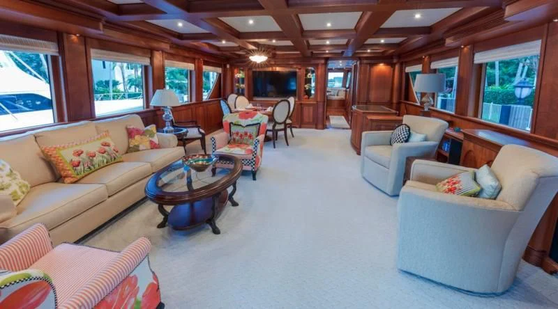 a living room with a couch and a table aboard ANNDRIANNA Yacht for Sale