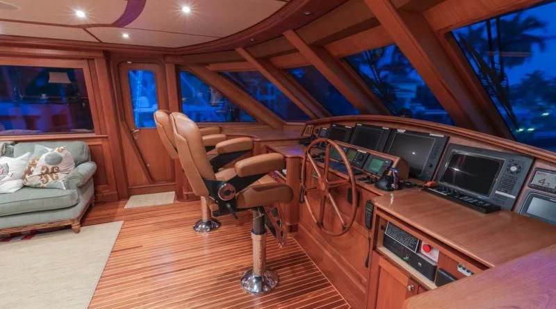 a room with a couch and a television aboard ANNDRIANNA Yacht for Sale