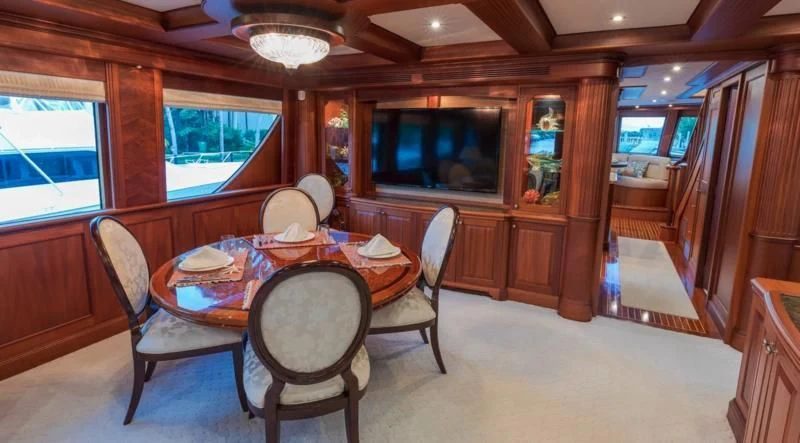 a dining room with a table and chairs aboard ANNDRIANNA Yacht for Sale