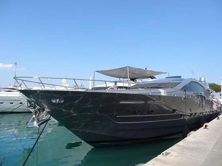 a boat docked at a pier aboard MUSE Yacht for Sale