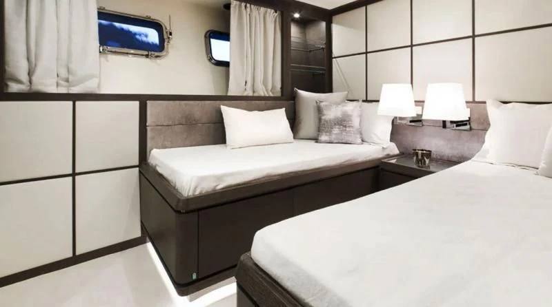 a room with two beds aboard MUSE Yacht for Sale