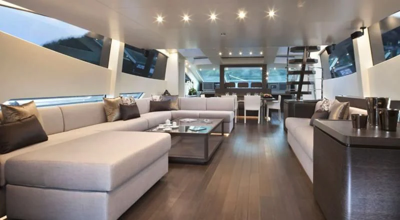 a living room with a large window aboard MUSE Yacht for Sale