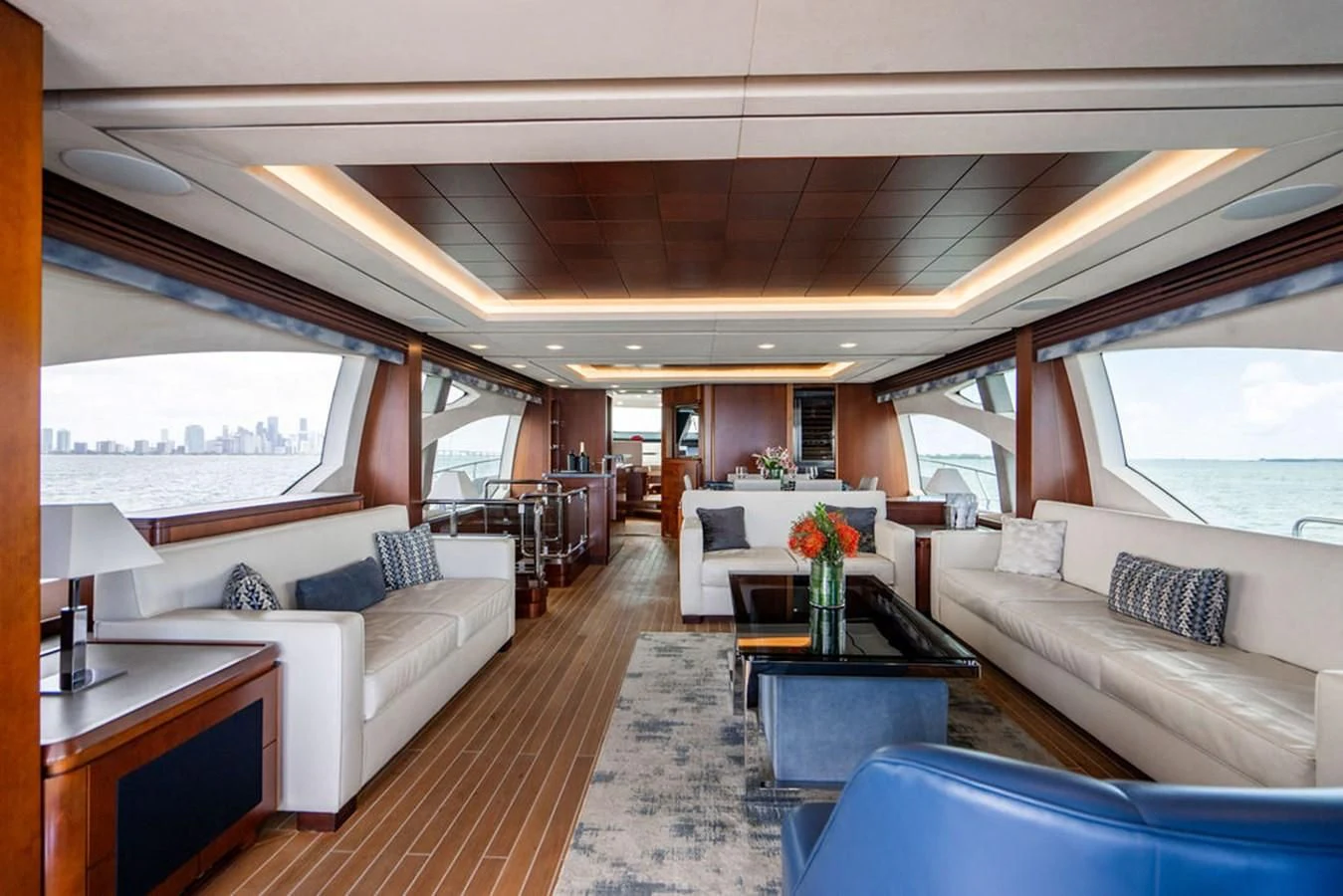 a living room with a large window aboard BM Yacht for Sale