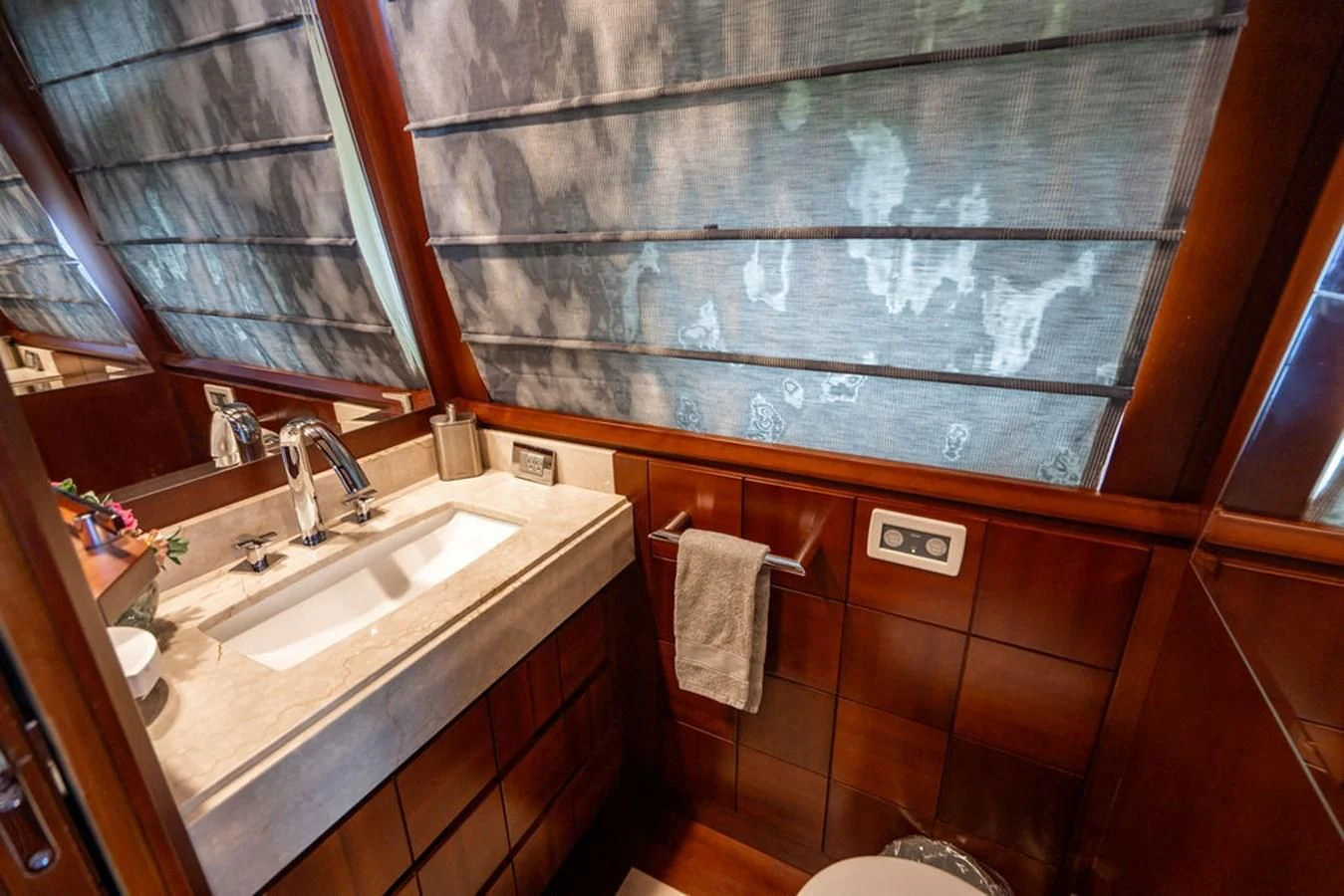 a bathroom with a sink and a mirror aboard BM Yacht for Sale