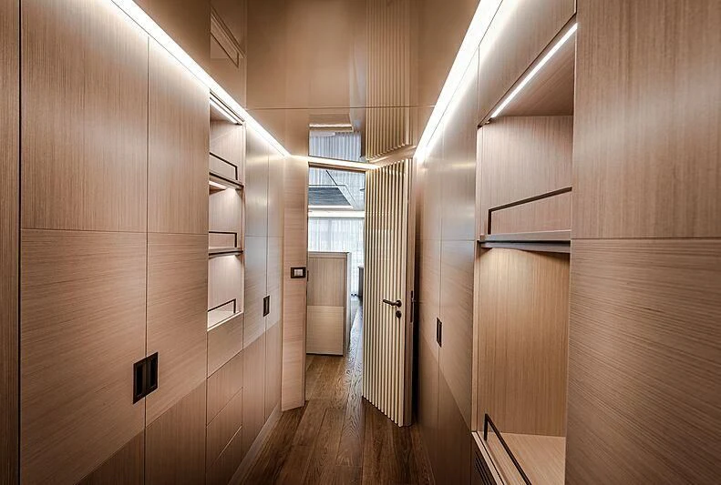 a room with wooden cabinets aboard MASHA Yacht for Sale