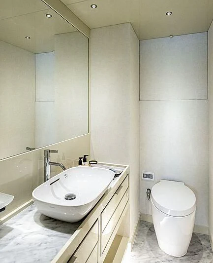 a bathroom with a sink and a toilet aboard MASHA Yacht for Sale