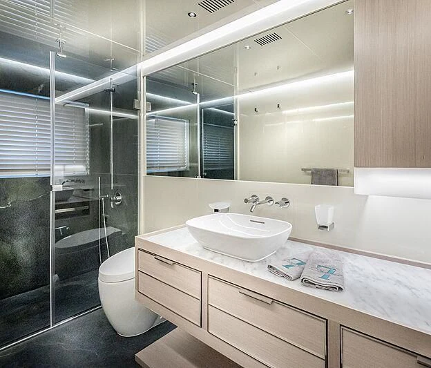 a bathroom with a glass shower aboard MASHA Yacht for Sale