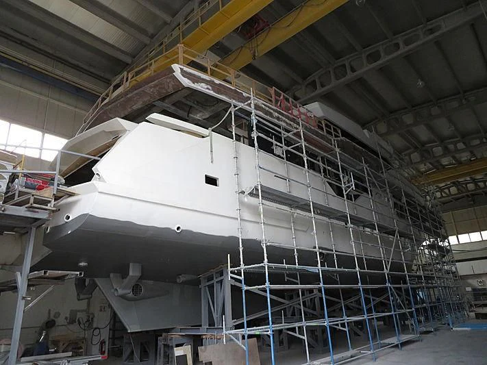 a large white machine in a factory aboard MASHA Yacht for Sale