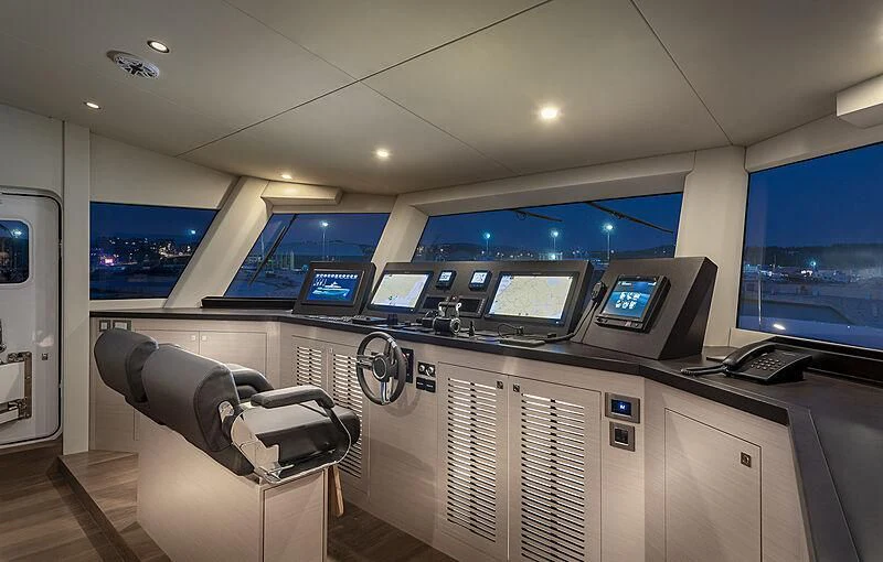 a room with computers and monitors aboard MASHA Yacht for Sale