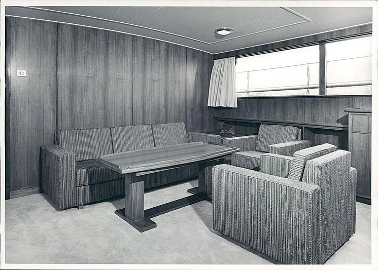 a room with a bench and a table aboard MAGICA STELLA Yacht for Sale