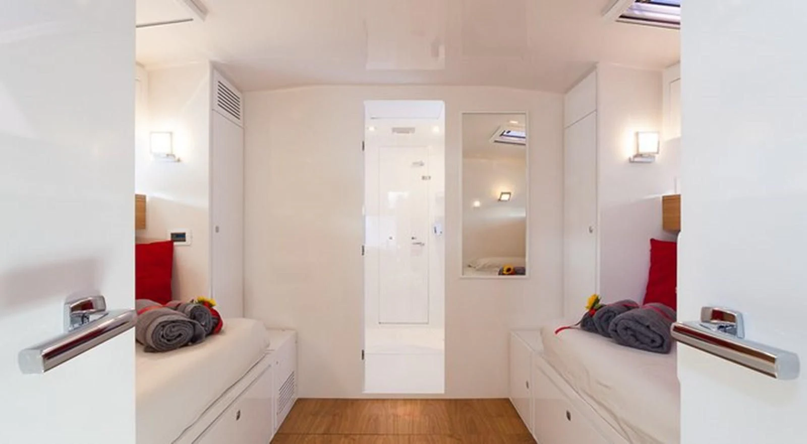 a room with a bed and a closet aboard RED CARPET Yacht for Sale