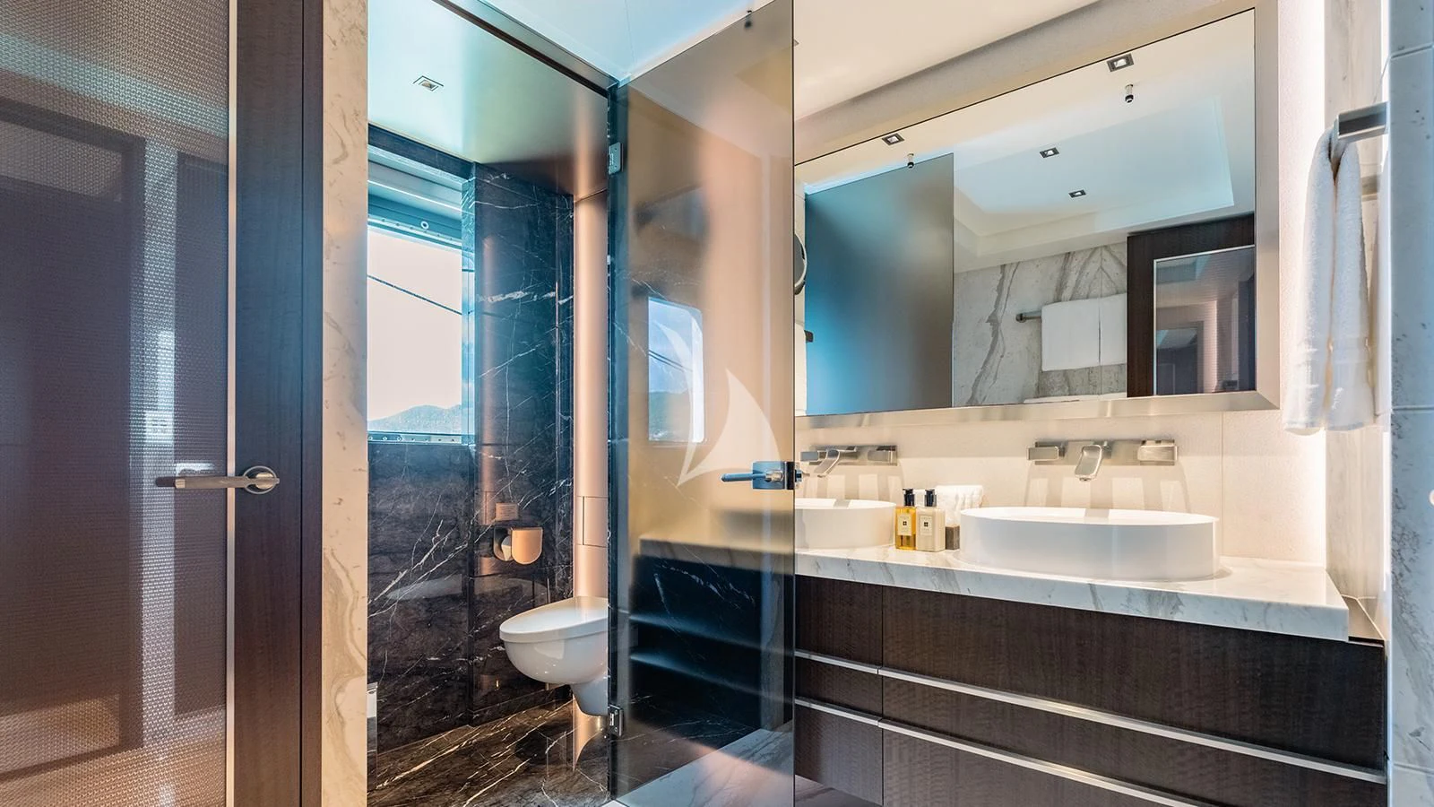 a bathroom with a sink and a mirror aboard MOSKITO Yacht for Sale