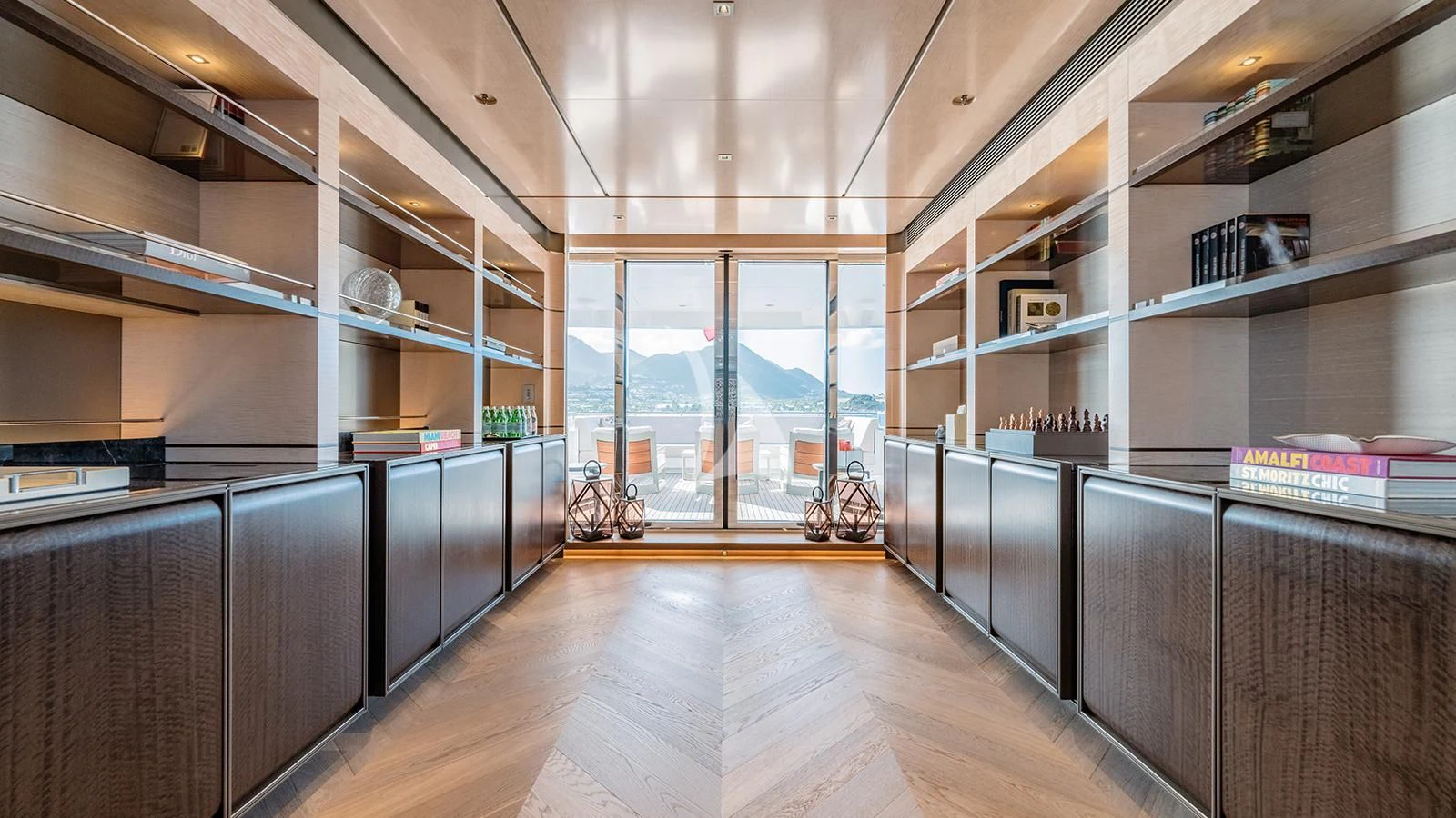 a room with a large wood floor aboard MOSKITO Yacht for Sale
