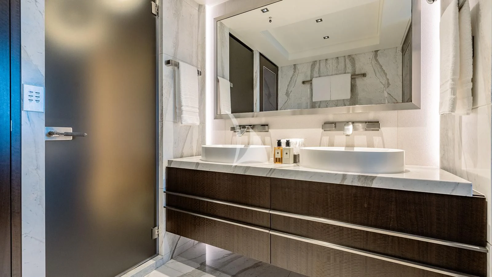 a bathroom with a sink and a mirror aboard MOSKITO Yacht for Sale