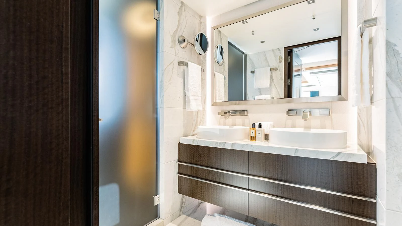 a bathroom with a large mirror aboard MOSKITO Yacht for Sale