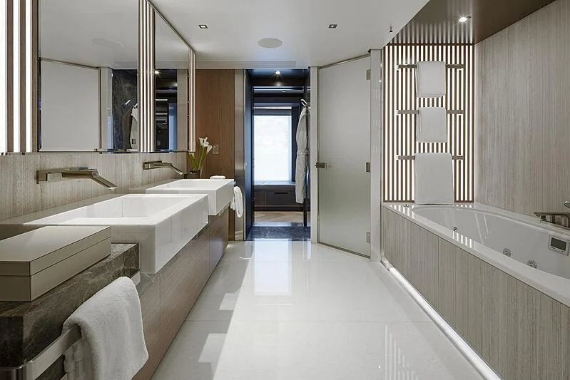 a bathroom with a tub sink and a shower unit aboard MOSKITO Yacht for Sale