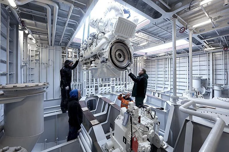 a few people in a factory aboard MOSKITO Yacht for Sale