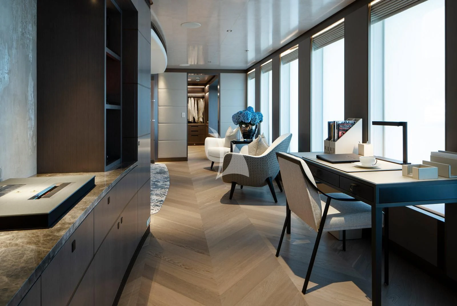 a person sitting at a desk aboard MOSKITO Yacht for Sale