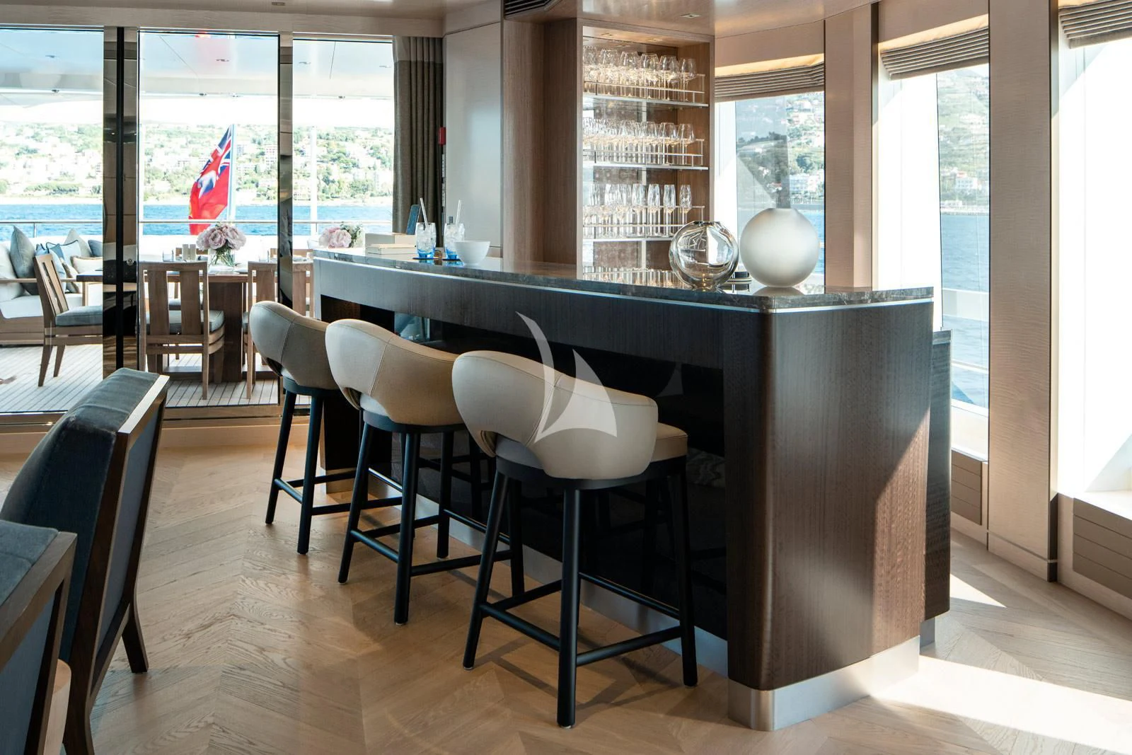 a large kitchen with a table and chairs aboard MOSKITO Yacht for Sale