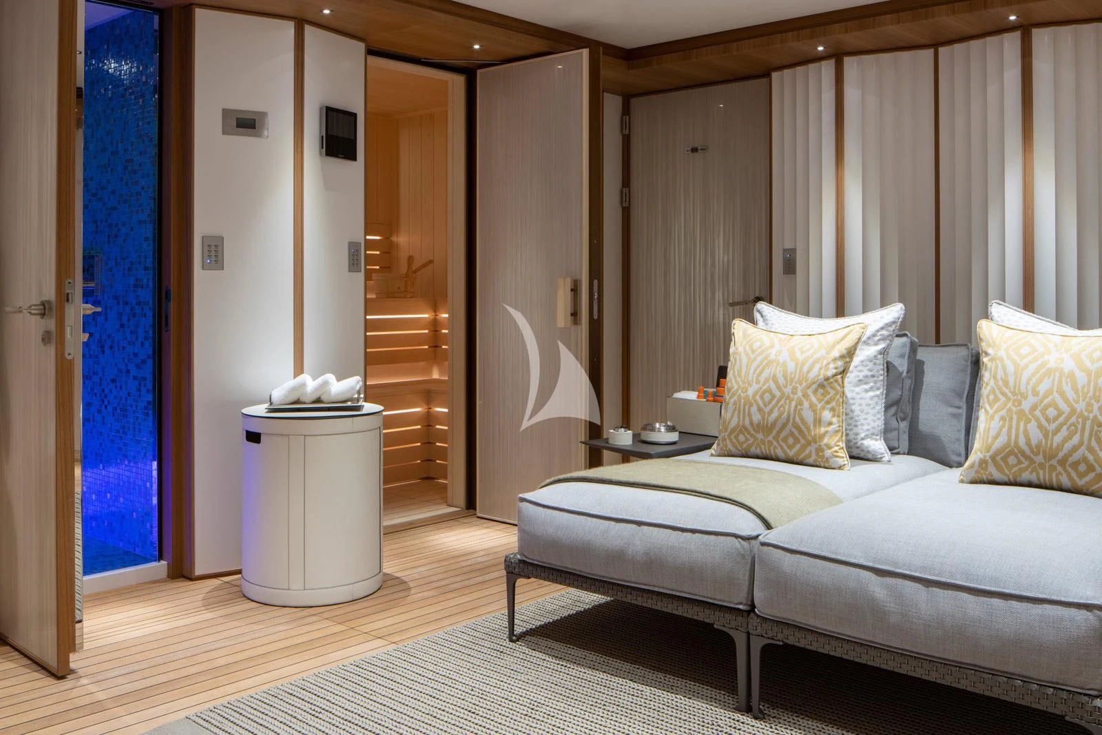 a living room with a couch and a table aboard MOSKITO Yacht for Sale