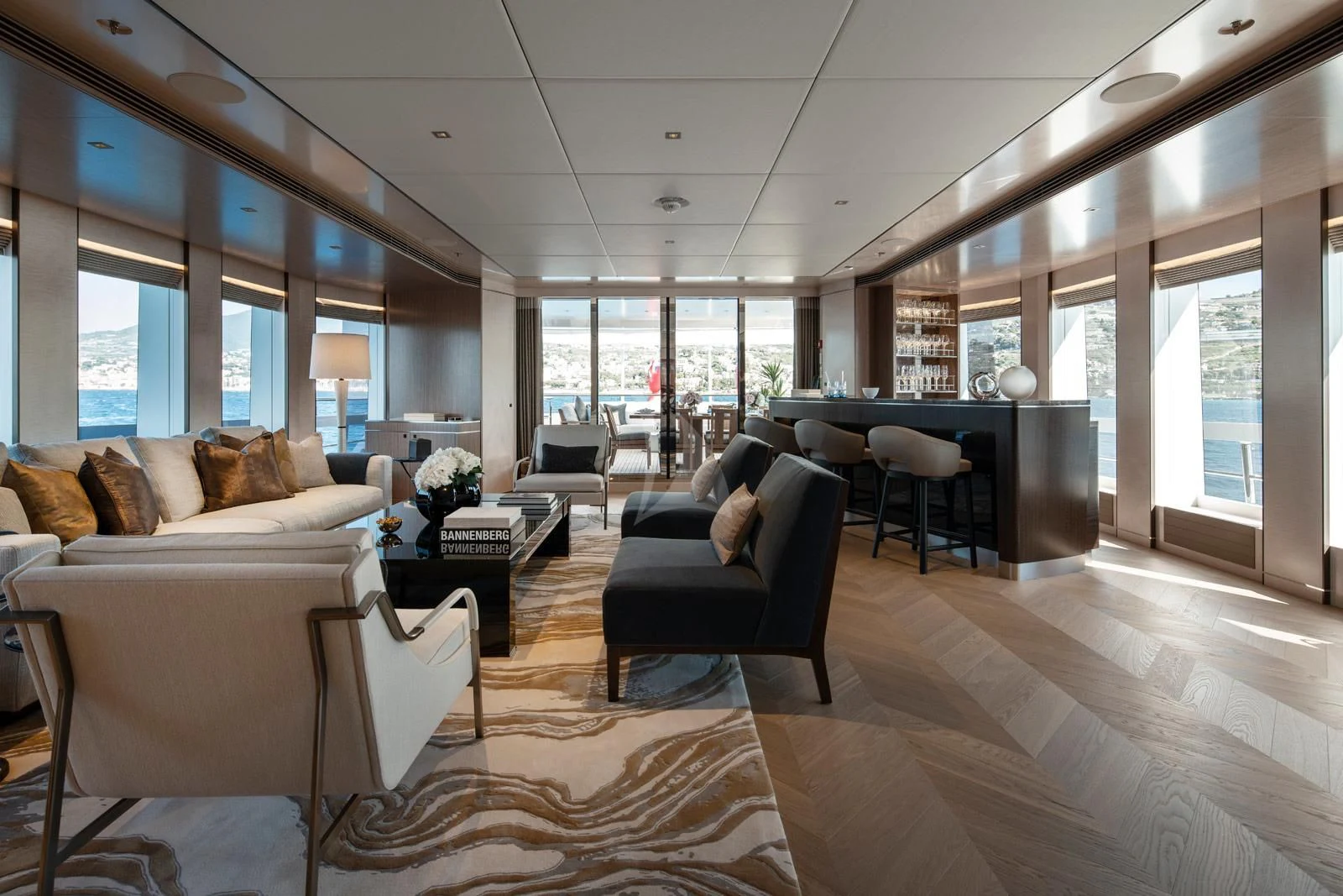 a living room with a wood floor aboard MOSKITO Yacht for Sale