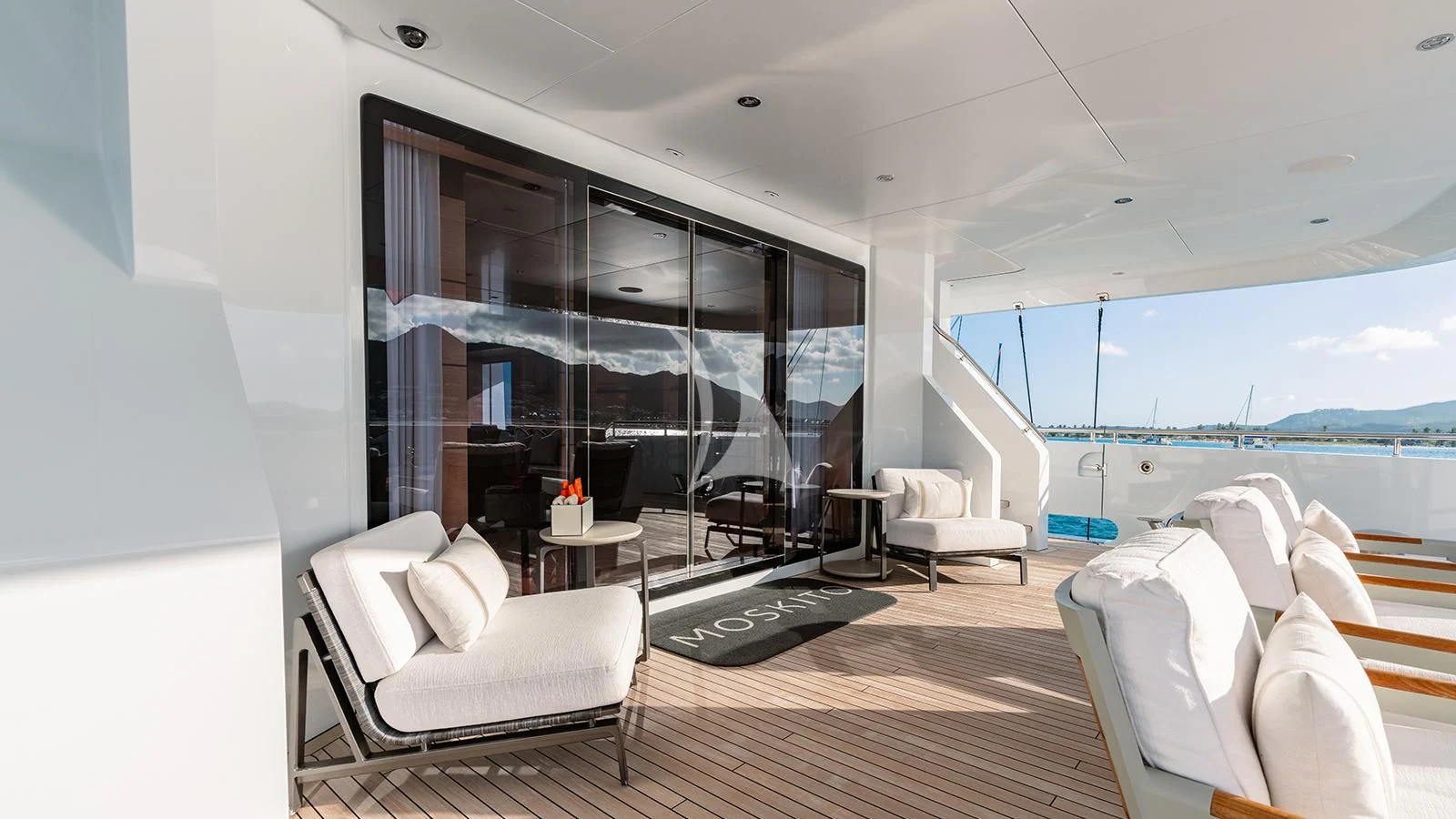 a room with a large window and a view of the ocean aboard MOSKITO Yacht for Sale