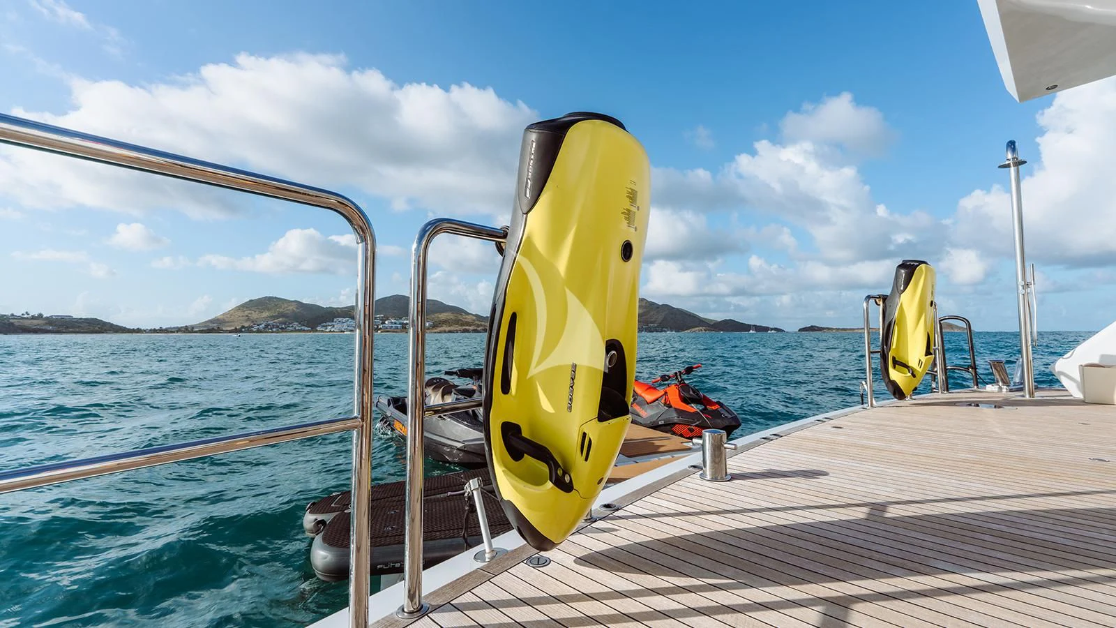 a yellow surfboard on a boat aboard MOSKITO Yacht for Sale