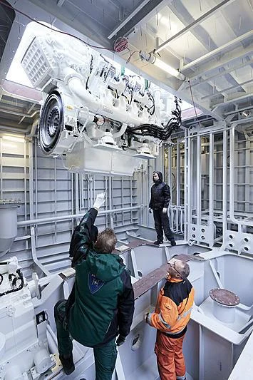 a group of people working in a factory aboard MOSKITO Yacht for Sale