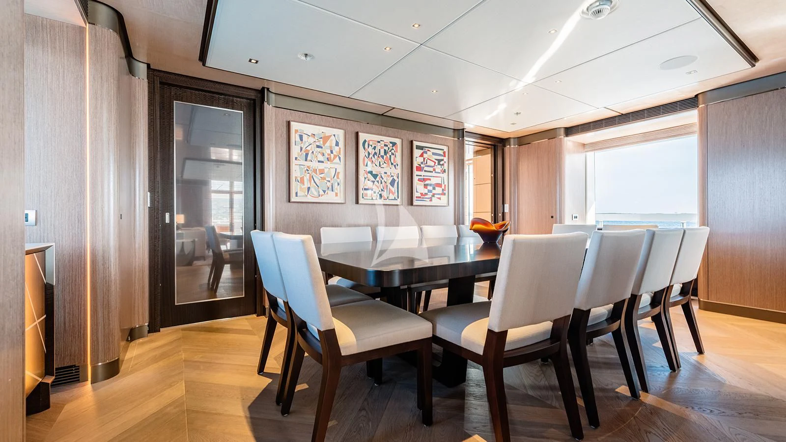 a room with tables and chairs aboard MOSKITO Yacht for Sale
