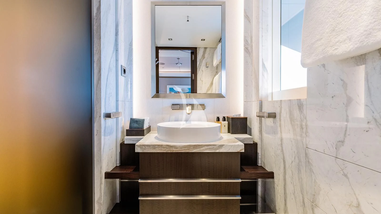 a bathroom with a sink and mirror aboard MOSKITO Yacht for Sale