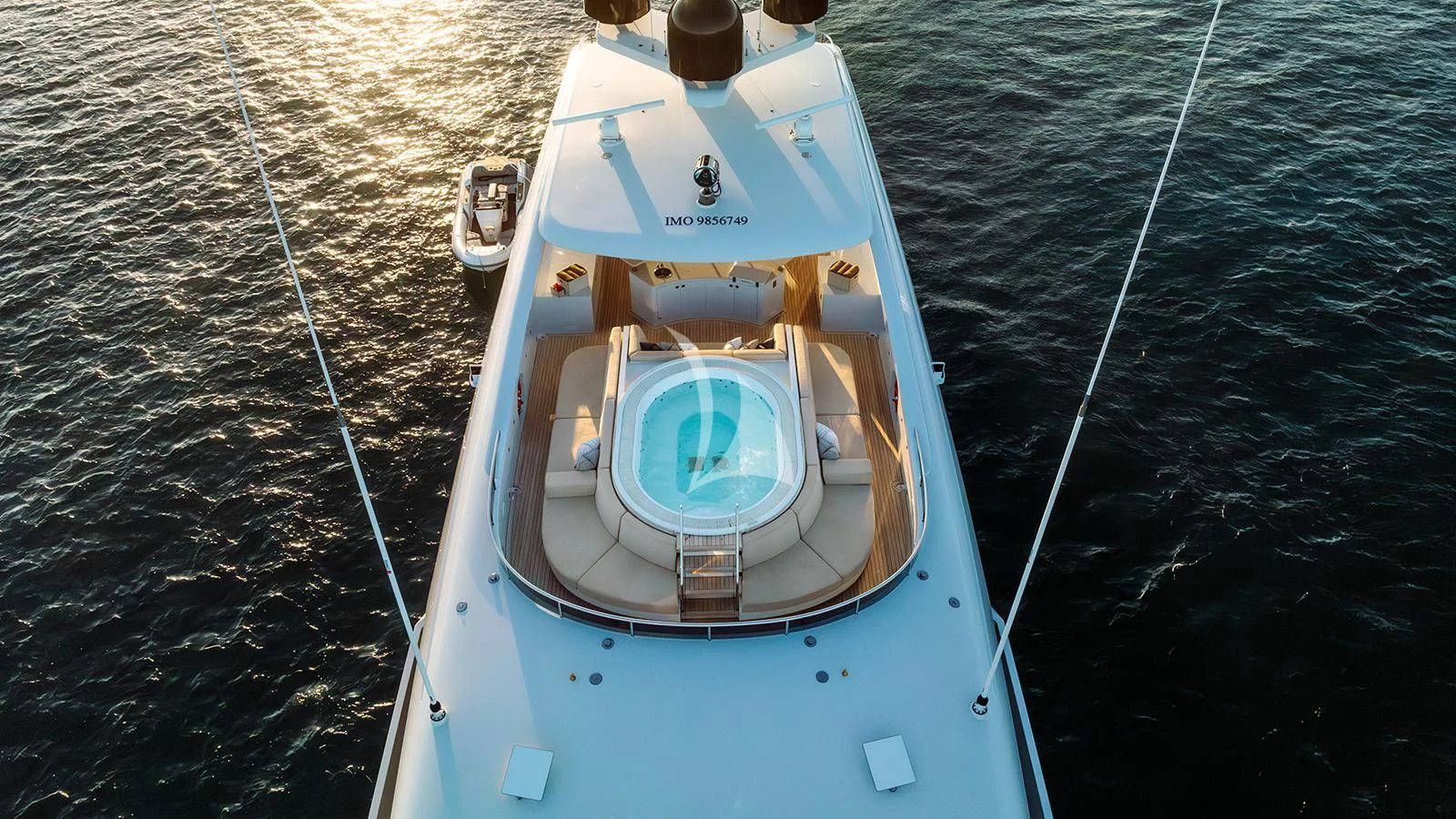 a white boat with a rope attached to it aboard MOSKITO Yacht for Sale