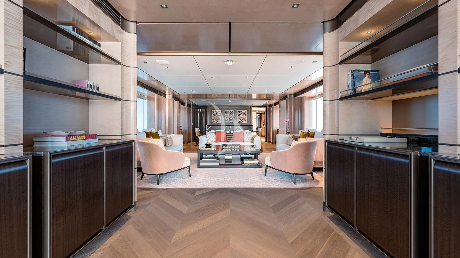 a room with a wood floor and a couch and a table aboard MOSKITO Yacht for Sale