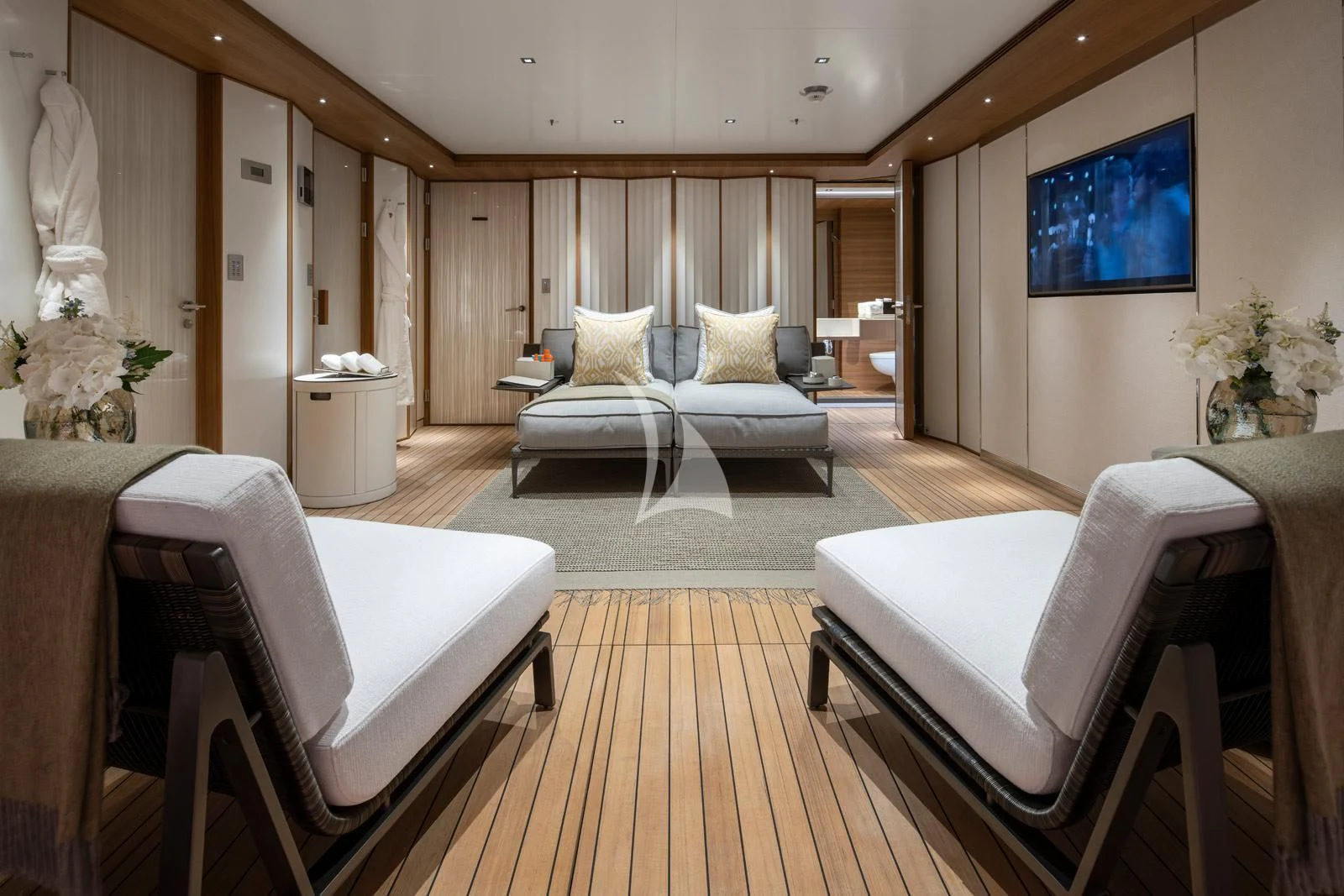 a living room with a large screen aboard MOSKITO Yacht for Sale