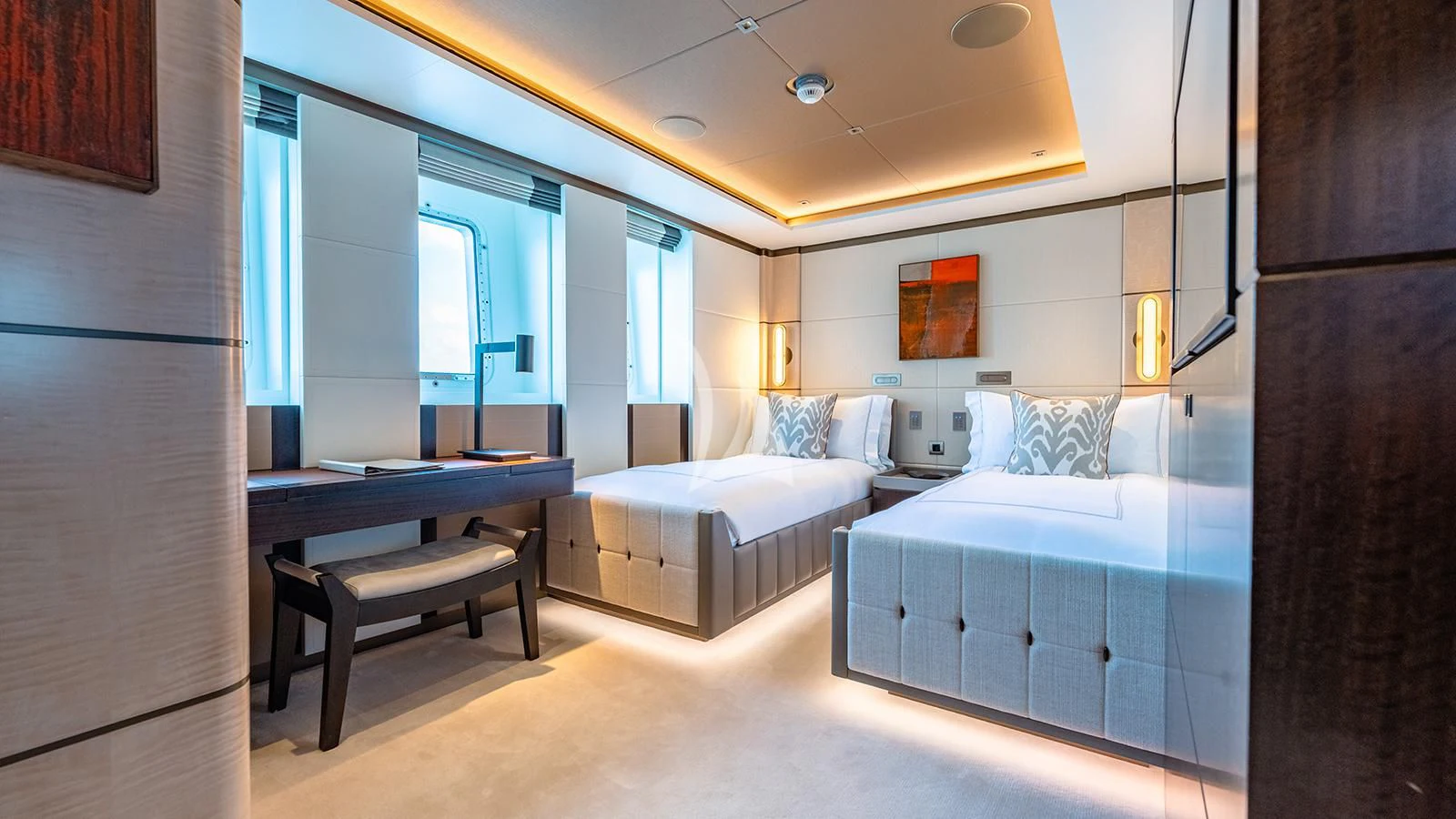 a room with a bed and desk aboard MOSKITO Yacht for Sale