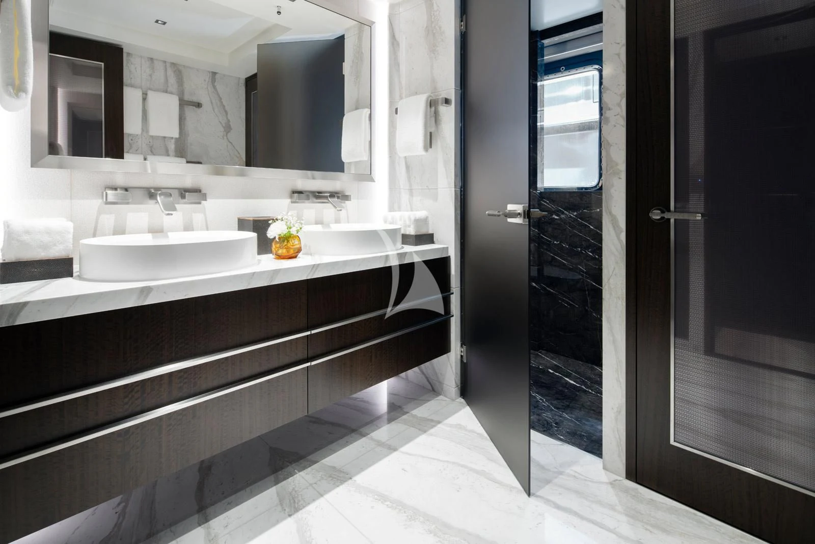 a bathroom with a sink and a mirror aboard MOSKITO Yacht for Sale