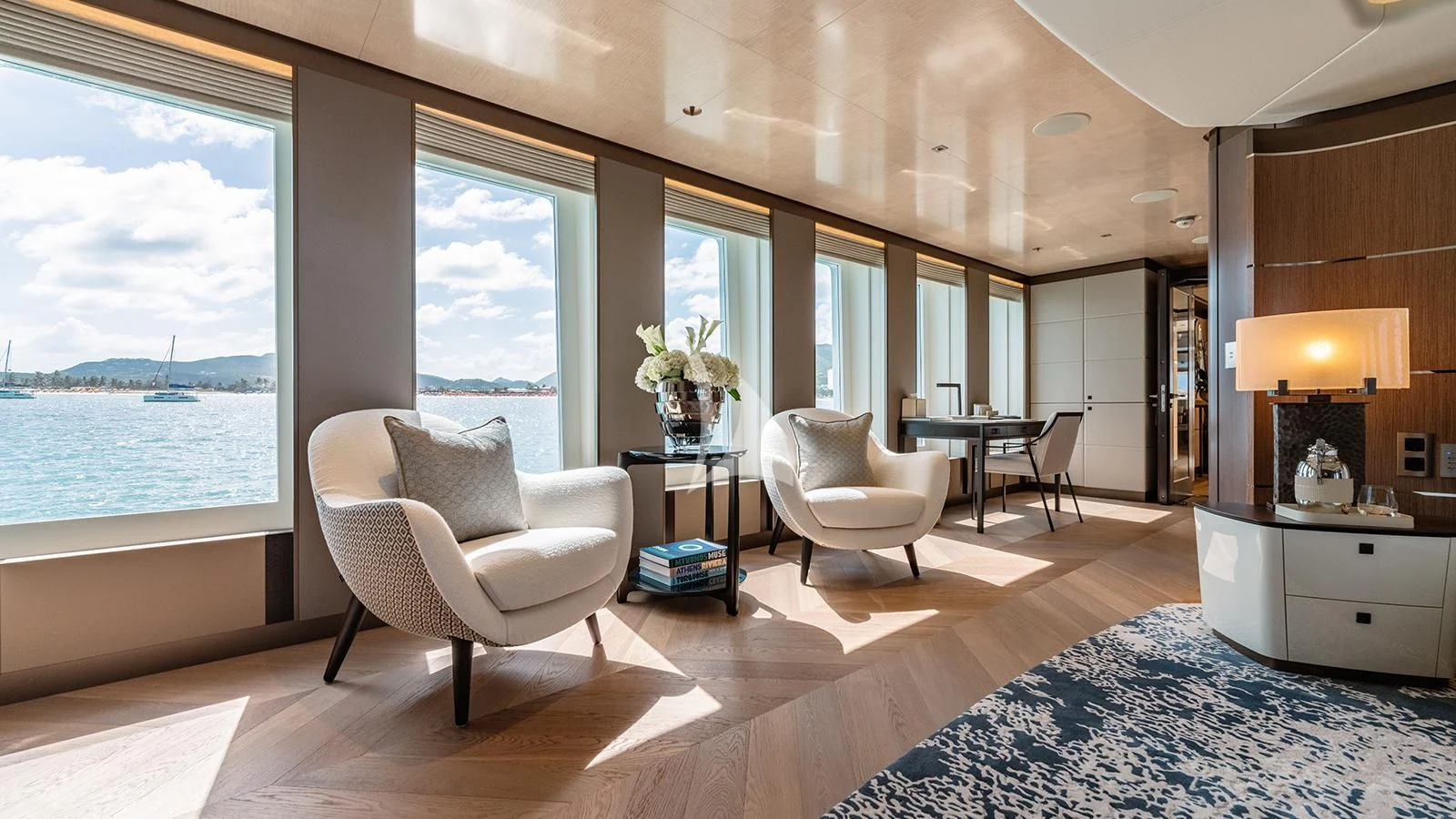 a living room with a large window aboard MOSKITO Yacht for Sale