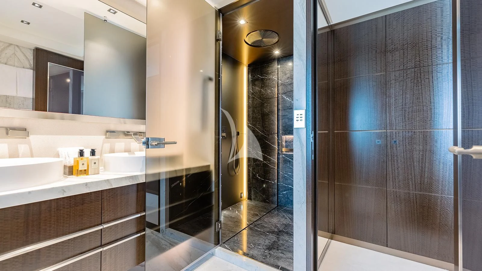 a bathroom with a glass shower aboard MOSKITO Yacht for Sale