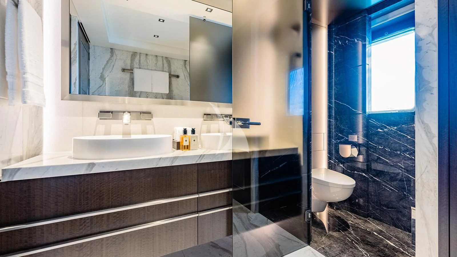 a bathroom with a tub sink and a toilet aboard MOSKITO Yacht for Sale
