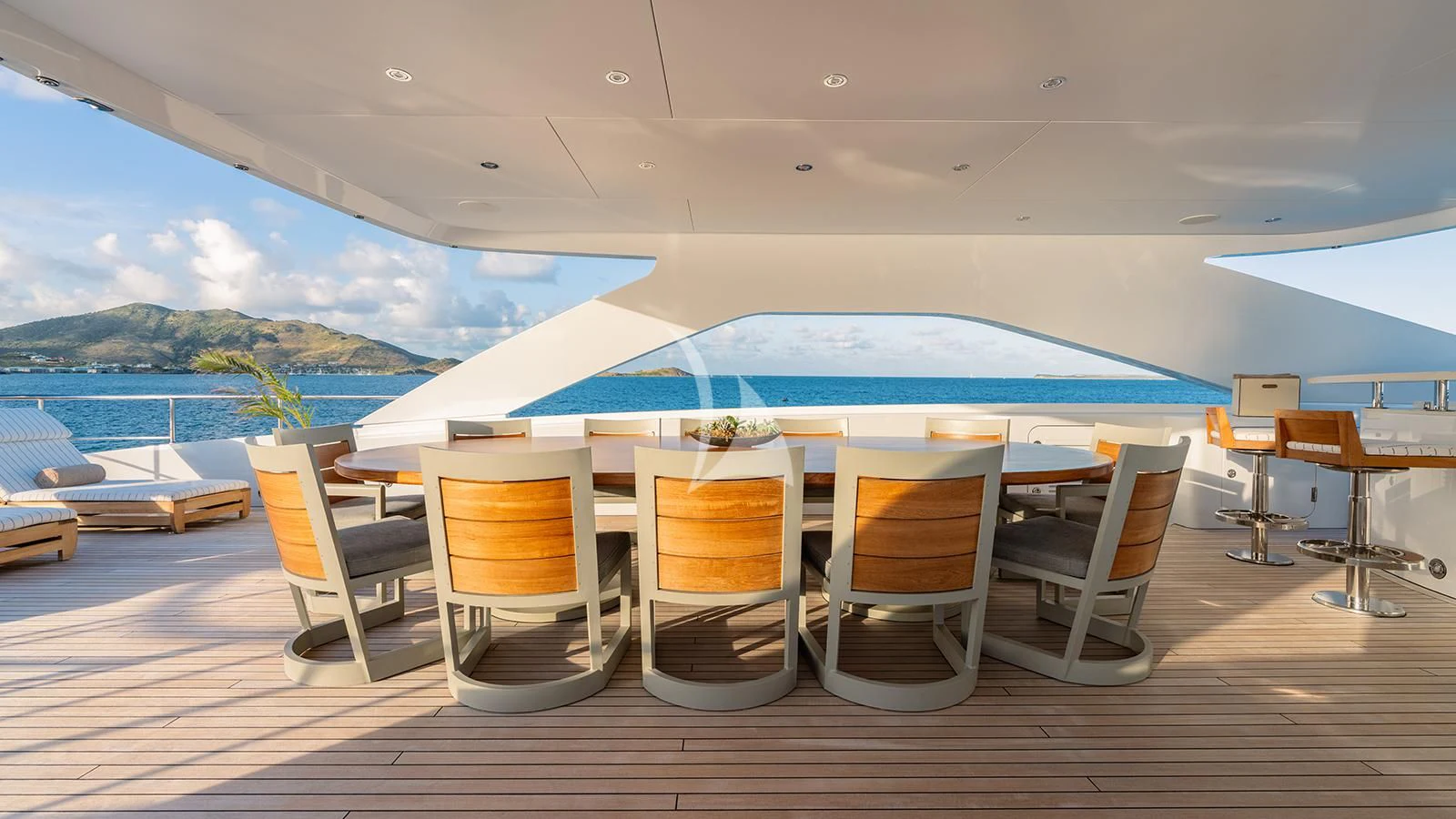 a room with a table chairs and a pool aboard MOSKITO Yacht for Sale