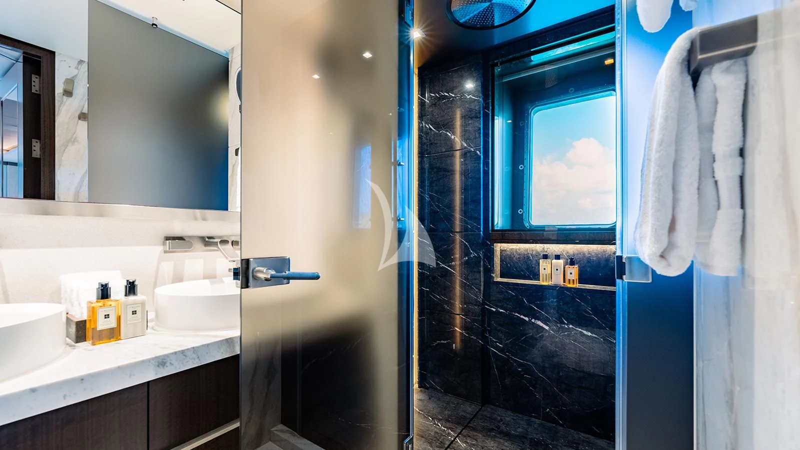 a bathroom with a sink and a mirror aboard MOSKITO Yacht for Sale
