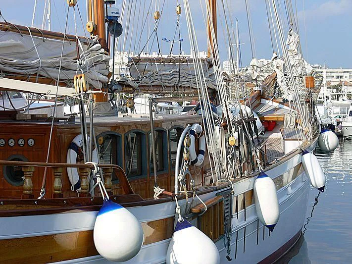 a boat is parked in a harbor aboard LA MAIA Yacht for Sale
