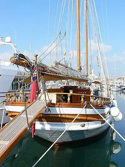 a boat with a red and white sail aboard LA MAIA Yacht for Sale