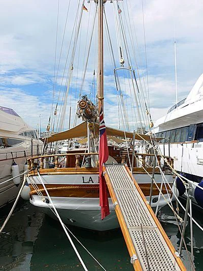 a boat tied to a dock aboard LA MAIA Yacht for Sale
