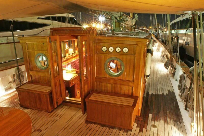a room with a wood cabinet aboard LA MAIA Yacht for Sale