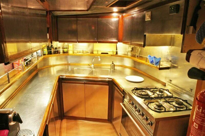 a kitchen with a stove and cabinets aboard LA MAIA Yacht for Sale