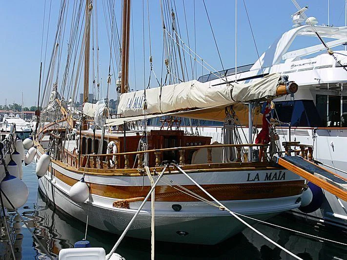 a boat docked in a harbor aboard LA MAIA Yacht for Sale